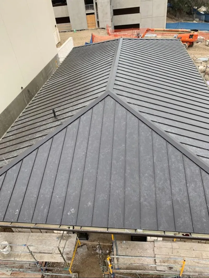 Commercial metal roof construction with crane equipment in Mount Sterling