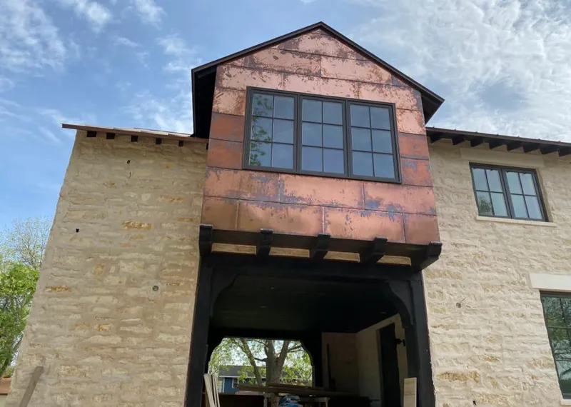 Copper metal panel facade on a stone building for Skylight Installation in Mount Sterling
